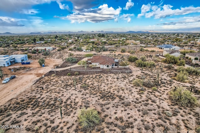 drone / aerial view with a desert view and a mountain view