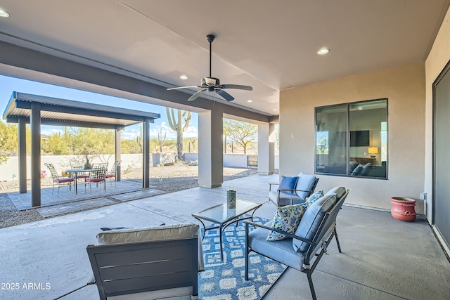 view of patio / terrace with ceiling fan, outdoor lounge area, and fence