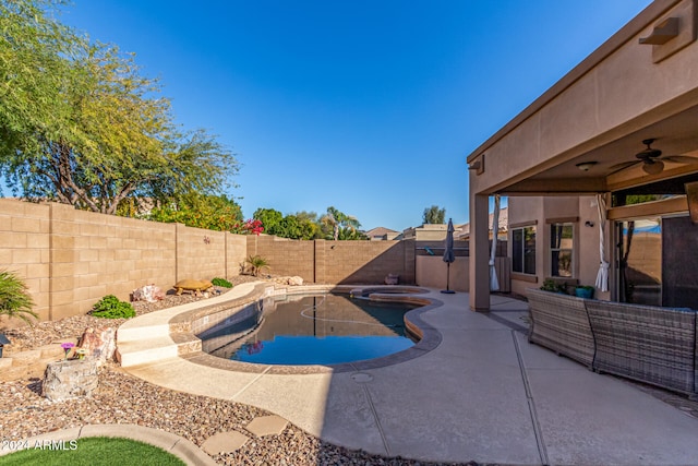 view of swimming pool featuring ceiling fan, an in ground hot tub, and a patio