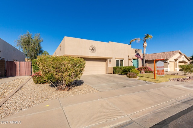 pueblo-style house with a garage