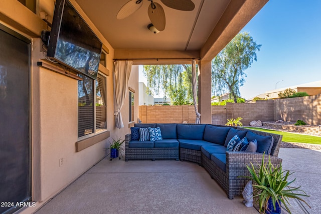 view of patio with an outdoor living space and ceiling fan