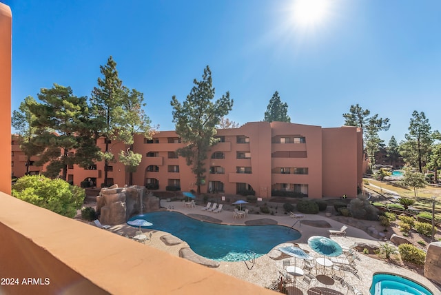 view of swimming pool featuring a patio area