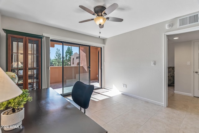 tiled home office with ceiling fan