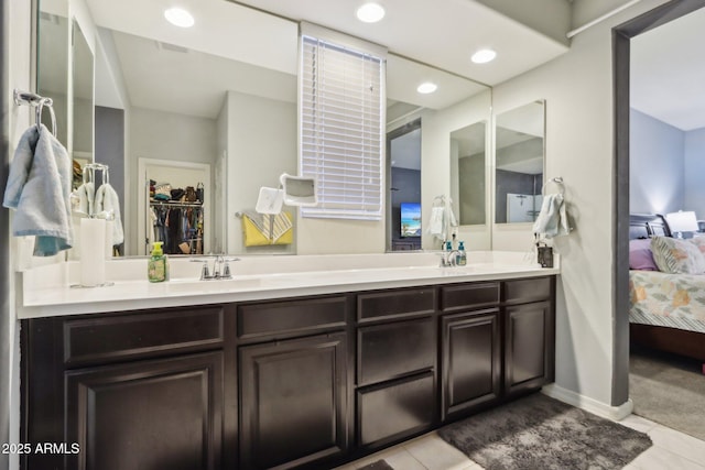 26049 W Matthew Dr, Buckeye, AZ 85396 - bathroom featuring ensuite bath, recessed lighting, tile patterned floors, double vanity, and baseboards