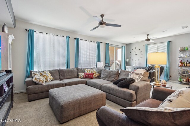 26049 W Matthew Dr, Buckeye, AZ 85396 - carpeted living room with visible vents, ceiling fan, and baseboards