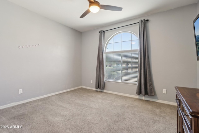 26049 W Matthew Dr, Buckeye, AZ 85396 - carpeted spare room with baseboards and a ceiling fan