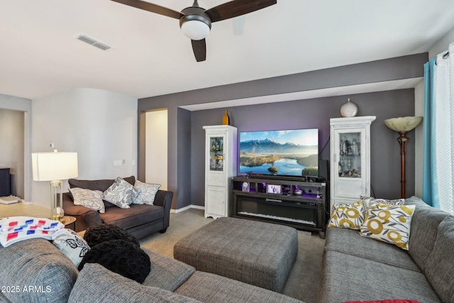 26049 W Matthew Dr, Buckeye, AZ 85396 - living room featuring visible vents, ceiling fan, baseboards, and carpet floors