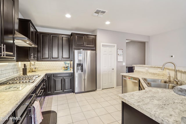 26049 W Matthew Dr, Buckeye, AZ 85396 - kitchen with light countertops, visible vents, decorative backsplash, stainless steel appliances, and a sink