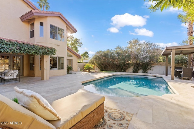 view of pool with french doors and a patio area