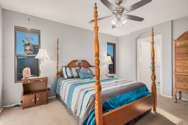 bedroom featuring light colored carpet and ceiling fan