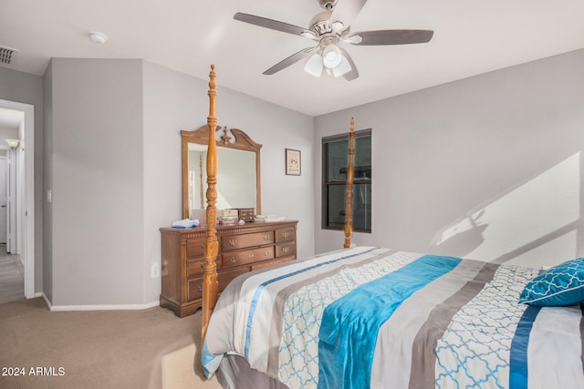 bedroom featuring ceiling fan and light carpet