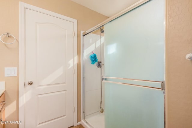 bathroom with vanity and an enclosed shower