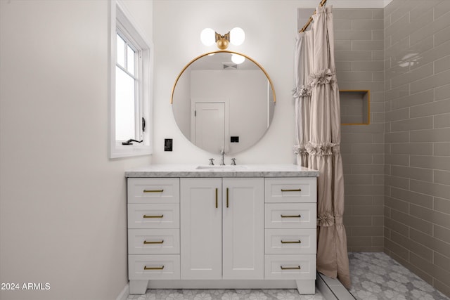 bathroom with vanity and curtained shower