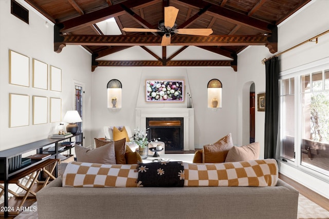 living room with beam ceiling, high vaulted ceiling, and wood ceiling