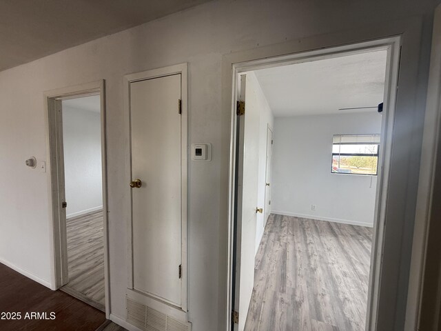 1020 W Schwartz Rd, Ajo, AZ 85321 - corridor featuring baseboards and wood finished floors