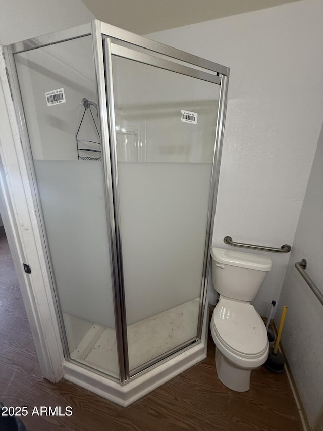 1020 W Schwartz Rd, Ajo, AZ 85321 - bathroom with toilet, wood finished floors, and a shower stall