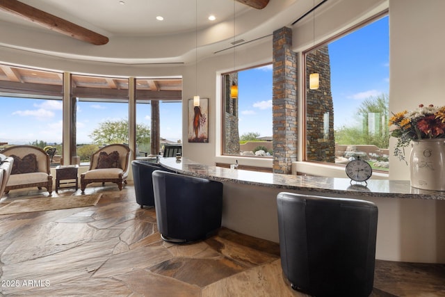 living room with beamed ceiling