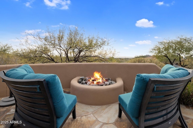 view of patio / terrace with an outdoor fire pit