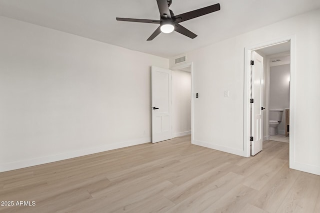 unfurnished bedroom with light wood-type flooring, ceiling fan, and ensuite bathroom