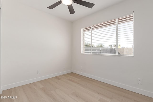 spare room with ceiling fan and light hardwood / wood-style flooring