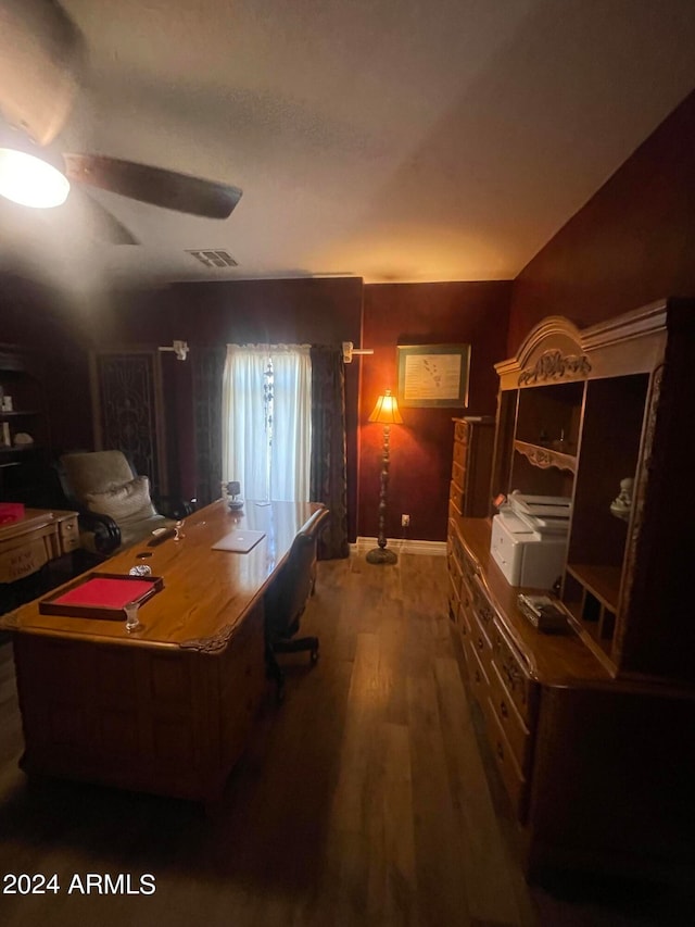 home office featuring wood-type flooring and ceiling fan