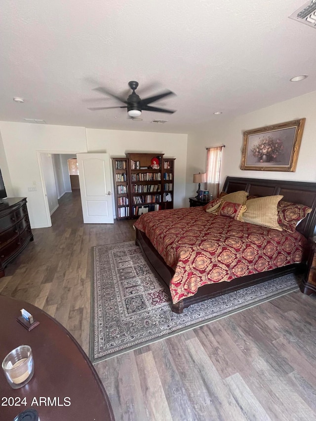 bedroom featuring ceiling fan and wood-type flooring