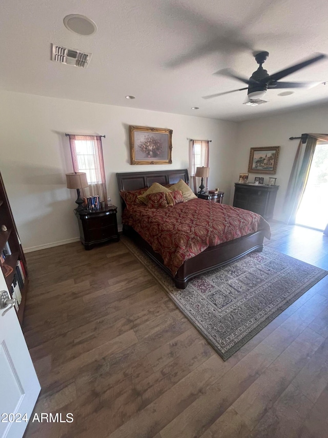 bedroom with hardwood / wood-style flooring and ceiling fan