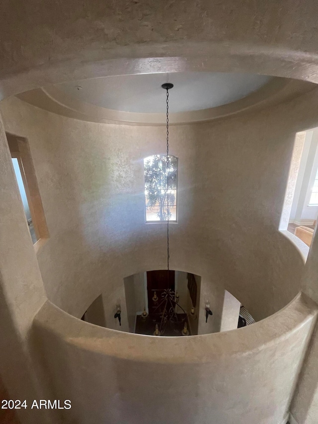 dining area featuring plenty of natural light and an inviting chandelier