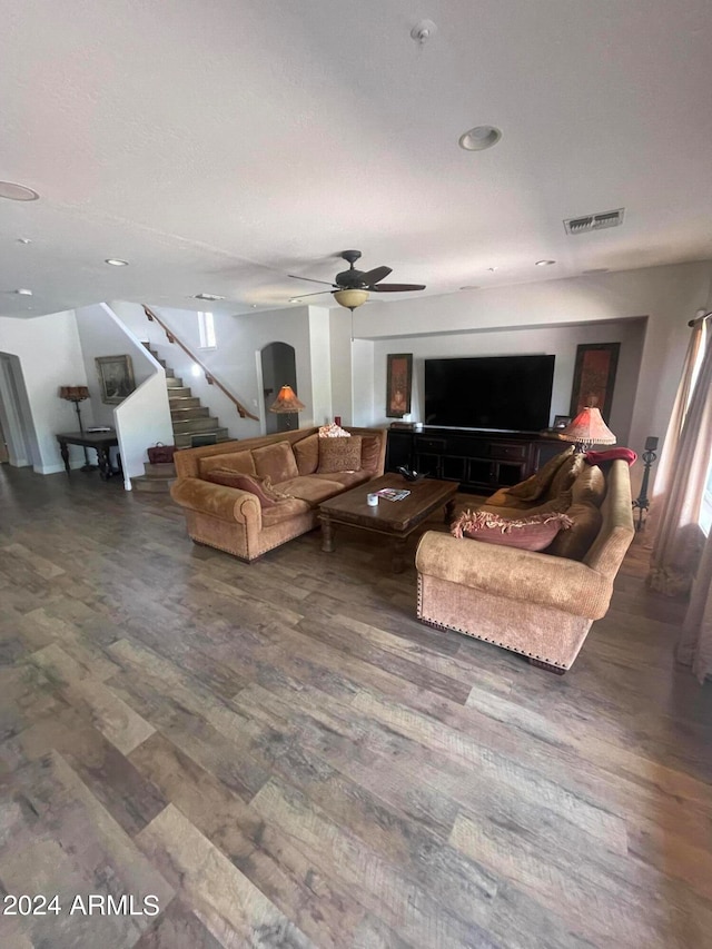 living room featuring hardwood / wood-style flooring and ceiling fan