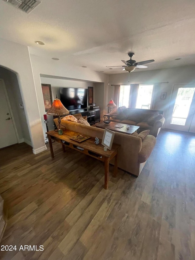 living room with hardwood / wood-style floors and ceiling fan