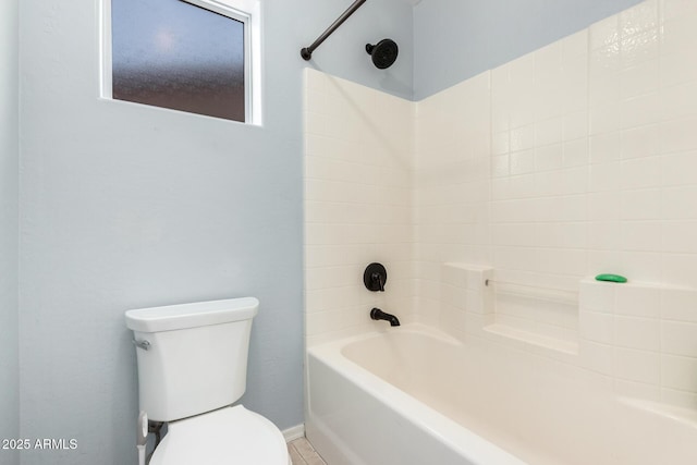 bathroom with toilet and bathtub / shower combination
