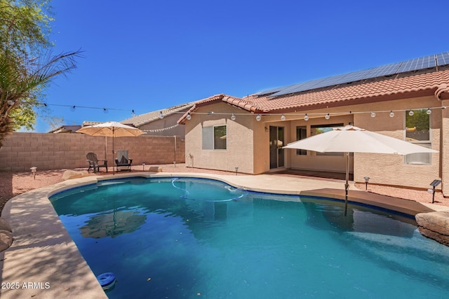 view of swimming pool with a fenced backyard, a fenced in pool, and a patio area