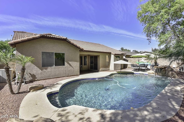 view of pool featuring fence, a patio area, central air condition unit, and a fenced in pool
