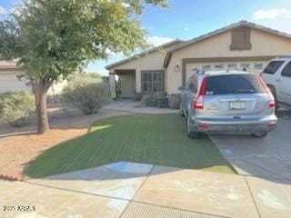 ranch-style house with driveway, a garage, and a front lawn