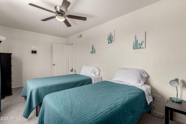 bedroom featuring baseboards, visible vents, ceiling fan, and light colored carpet