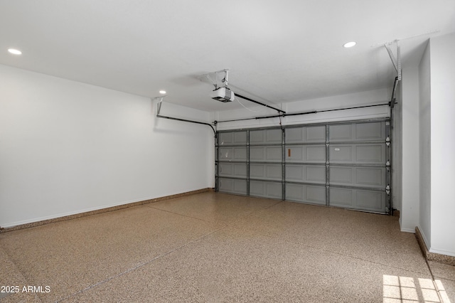 garage with a garage door opener, baseboards, and recessed lighting