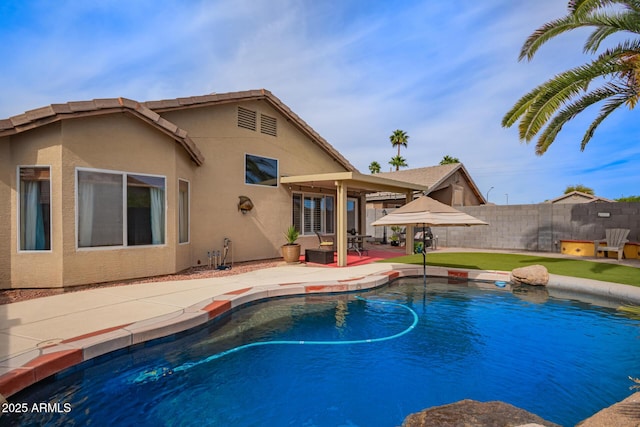 view of swimming pool featuring fence, a patio area, and a fenced in pool