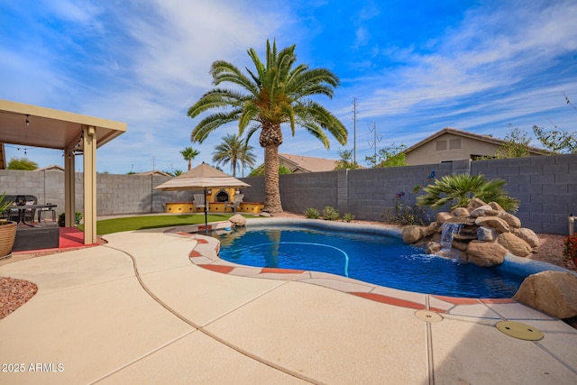 view of pool featuring a fenced in pool, a fenced backyard, and a patio area