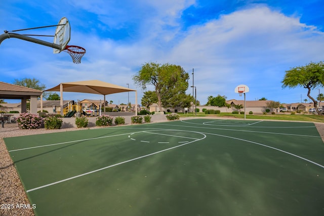 view of basketball court featuring playground community and community basketball court
