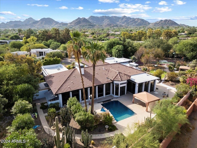 birds eye view of property with a mountain view