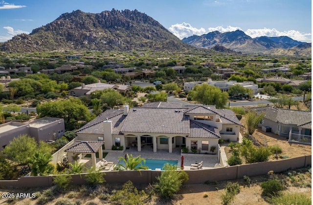 birds eye view of property with a mountain view