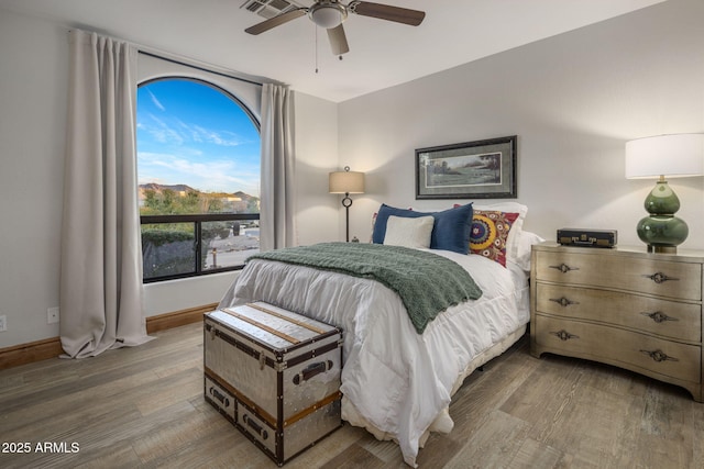 bedroom featuring ceiling fan and hardwood / wood-style flooring