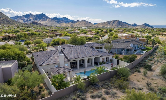 birds eye view of property featuring a mountain view