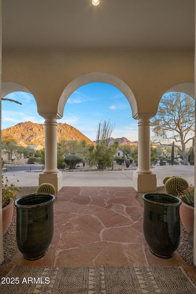 view of patio / terrace featuring a mountain view