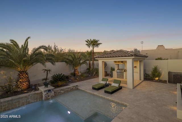 exterior space featuring a patio area, pool water feature, and area for grilling