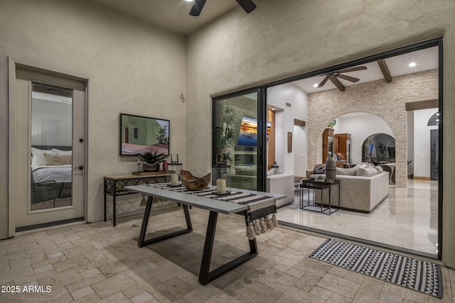 view of patio / terrace with ceiling fan and an outdoor living space