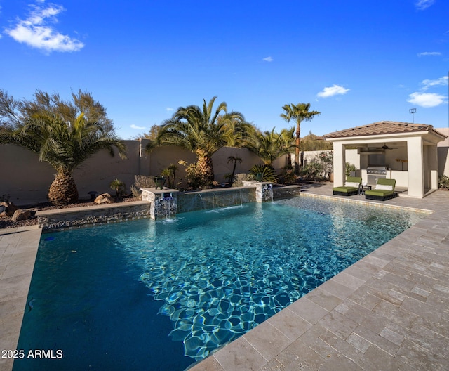 view of swimming pool with pool water feature, area for grilling, a patio, and ceiling fan