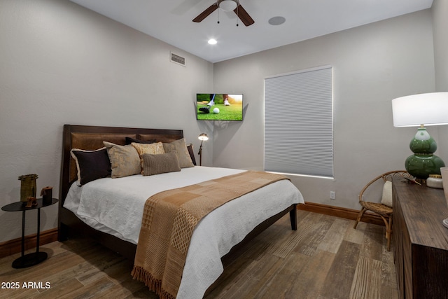 bedroom with ceiling fan and hardwood / wood-style floors