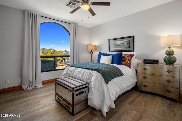 bedroom with ceiling fan and hardwood / wood-style floors