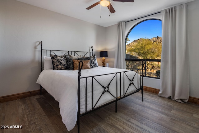 bedroom featuring ceiling fan and hardwood / wood-style floors